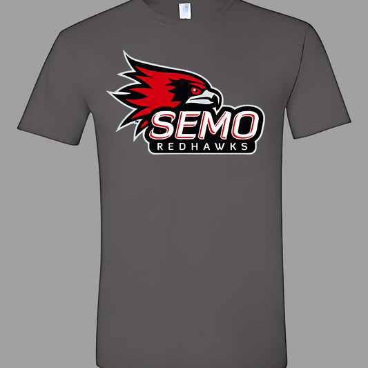 This vibrant t-shirt features the iconic SEMO Redhawk logo prominently displayed at the top, showcasing the fierce spirit of the team. Below the hawk, bold bubble letters spell out "SEMO," creating a playful and eye-catching design. Just underneath, in smaller, stylish print, the word "Redhawks" completes the look, making it a perfect blend of fun and team pride.  Shop at Gorgeousware.com