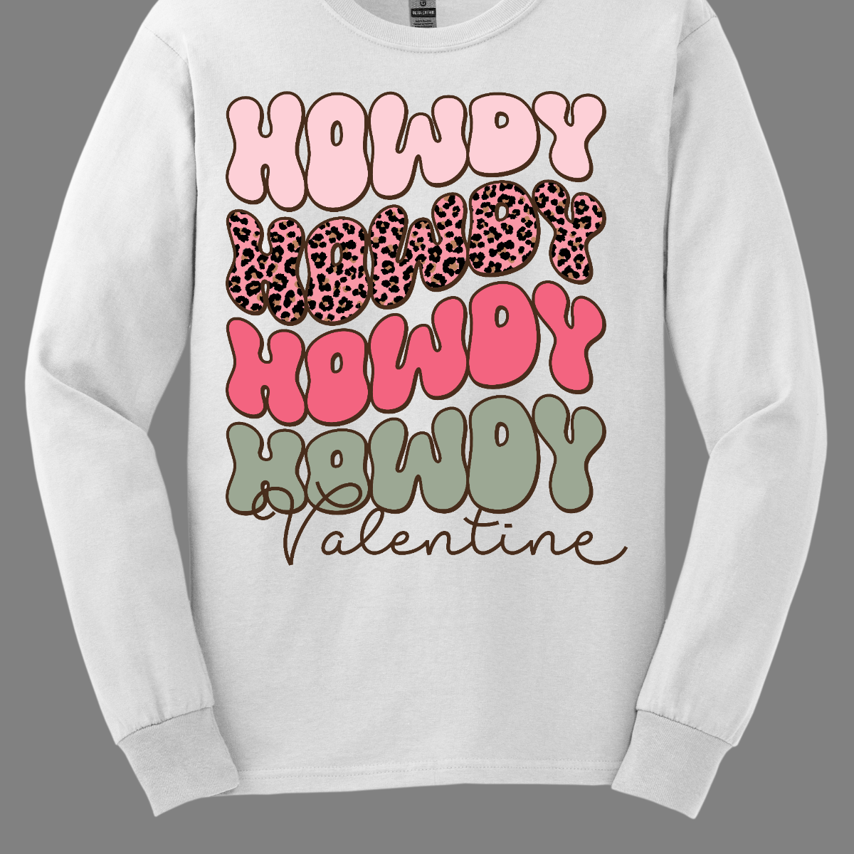 Introducing our "Howdy Valentine" T-shirt – a retro-inspired masterpiece that adds a touch of vintage charm to your Valentine's Day celebration. This shirt features a stylish retro font in soft pinks and sage colors, creating a delightful and nostalgic vibe perfect for expressing love with a Western twist.  The phrase "Howdy Valentine" is elegantly displayed in a retro font, evoking the classic aesthetics of bygone eras. Shop at Gorgeousware.com