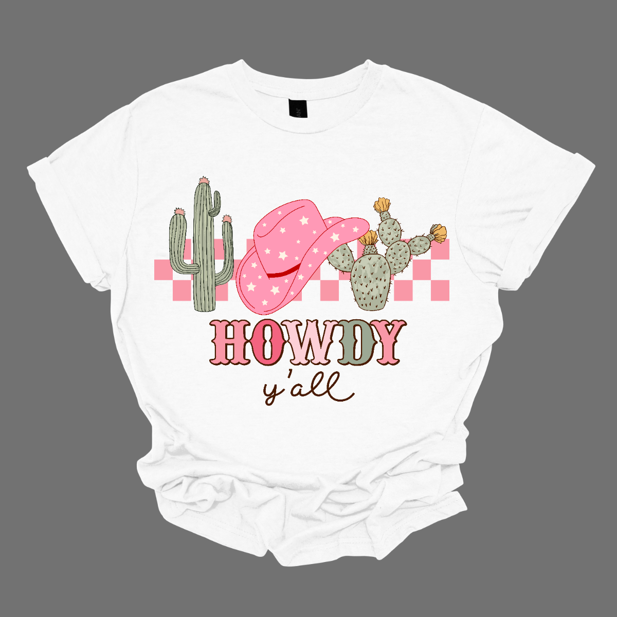 Introducing our "Howdy Ya'll" T-shirt – a spirited and charming garment that welcomes everyone with a touch of Southern hospitality. This shirt features a delightful design adorned with cactuses and a stylish cowgirl hat, creating a perfect blend of country Western flair and friendly greetings.  The cactuses add a touch of desert charm, while the cowgirl hat brings a stylish and playful element to the overall design. Shop at Gorgeousware.com