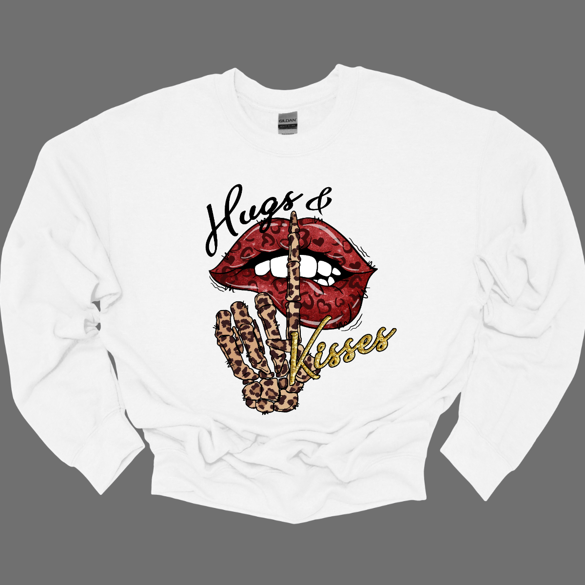 Introducing our "Hugs & Kisses" T-shirt – a sassy and playful garment that combines the sweetness of hugs and kisses with a touch of edgy flair. This shirt features red leopard print lips and a stylish leopard print skeleton holding its finger up to its lips, creating a unique and trendy design. The red leopard print lips add a touch of romance and playfulness, while the leopard print skeleton introduces a chic and edgy element to the overall design. Shop at Gorgeousware.com