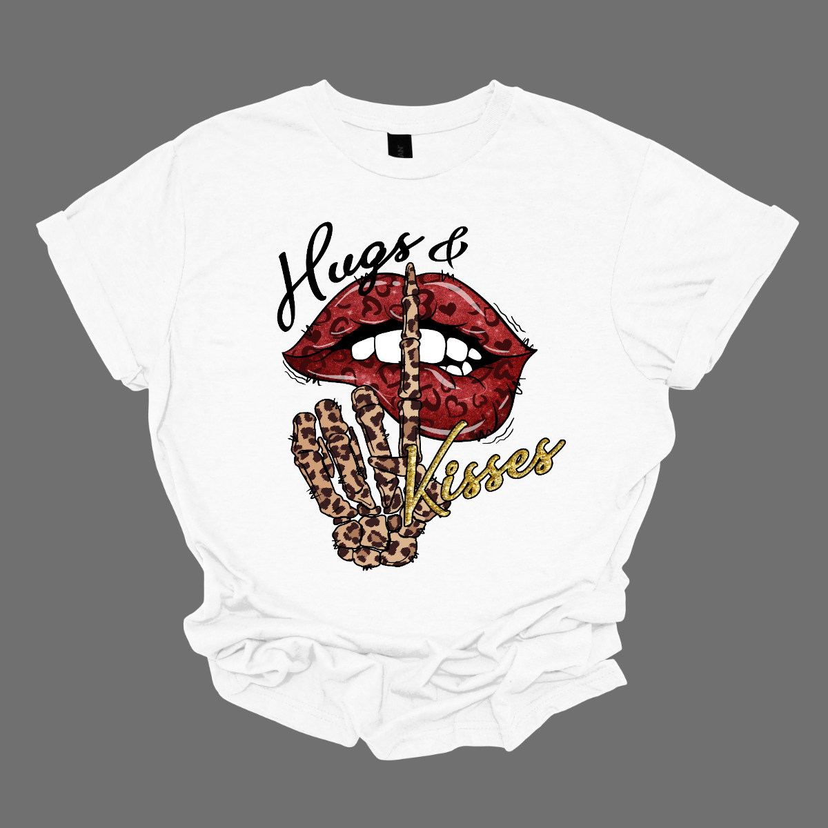 Introducing our "Hugs & Kisses" T-shirt – a sassy and playful garment that combines the sweetness of hugs and kisses with a touch of edgy flair. This shirt features red leopard print lips and a stylish leopard print skeleton holding its finger up to its lips, creating a unique and trendy design. The red leopard print lips add a touch of romance and playfulness, while the leopard print skeleton introduces a chic and edgy element to the overall design. Shop at Gorgeousware.com