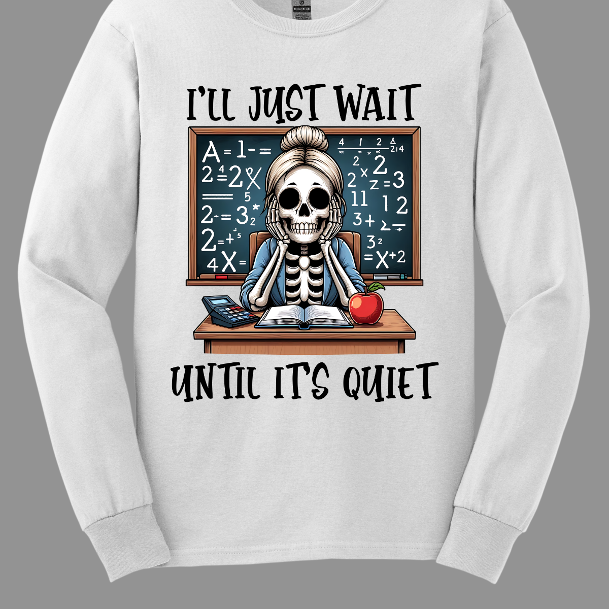 This T-shirt features a skeleton sitting at a cluttered desk, dressed in a cozy cardigan with a messy bun on top of its skull. The skeleton is leaning forward, resting its head on its bony hands as if exhausted or overwhelmed.  The shirt says, "I'll just wait until its quiet".  Shop at Gorgeousware.com 