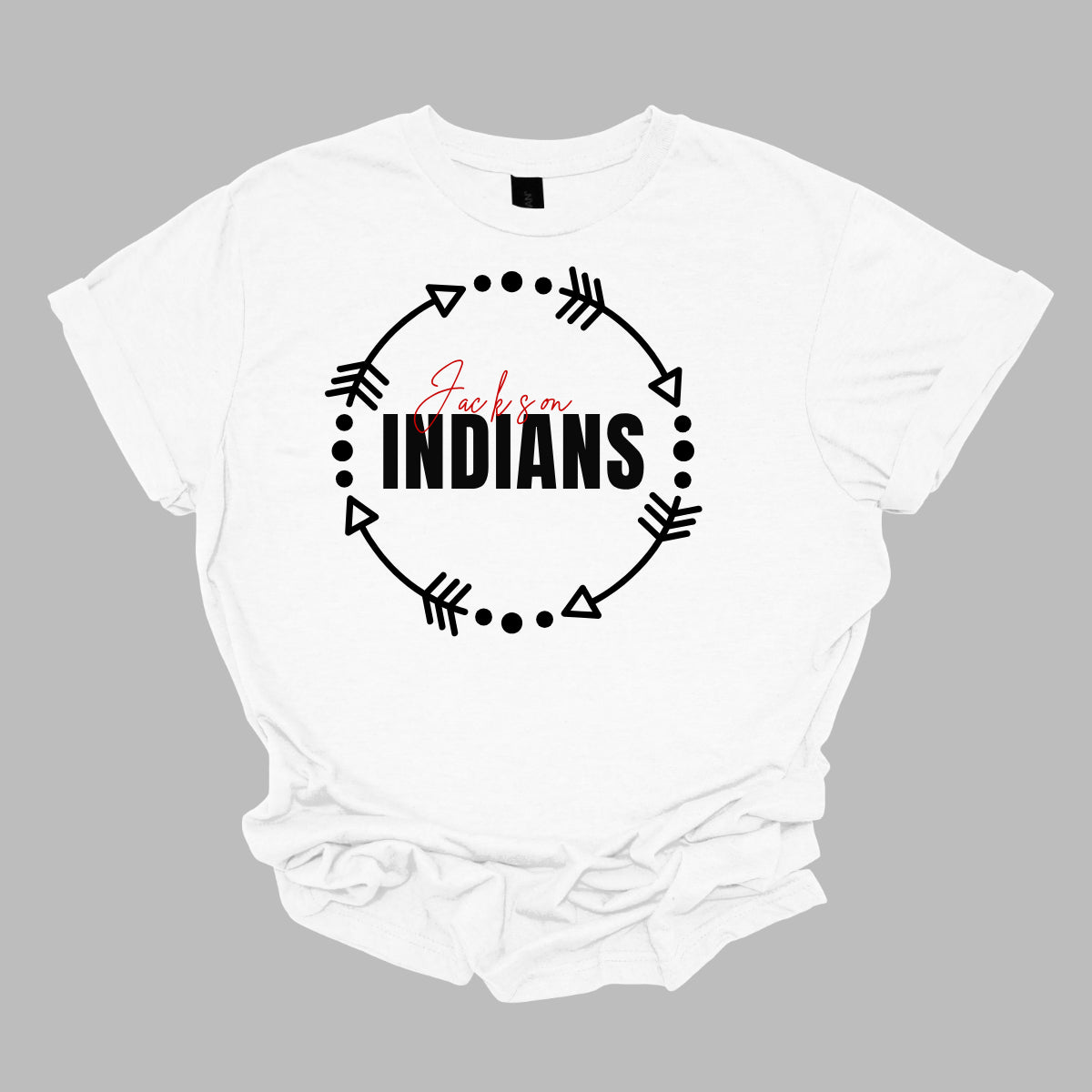 The T-shirt design features a dynamic and spirited look with a white arrow circle at its center. This circle encircles the words "Jackson" and "Indians" in a striking color scheme highlighting school pride. The arrow circle adds a sense of movement and energy, making the overall design both modern and eye-catching. This T-shirt is perfect for showcasing school spirit with style. Shop at gorgeousware.com