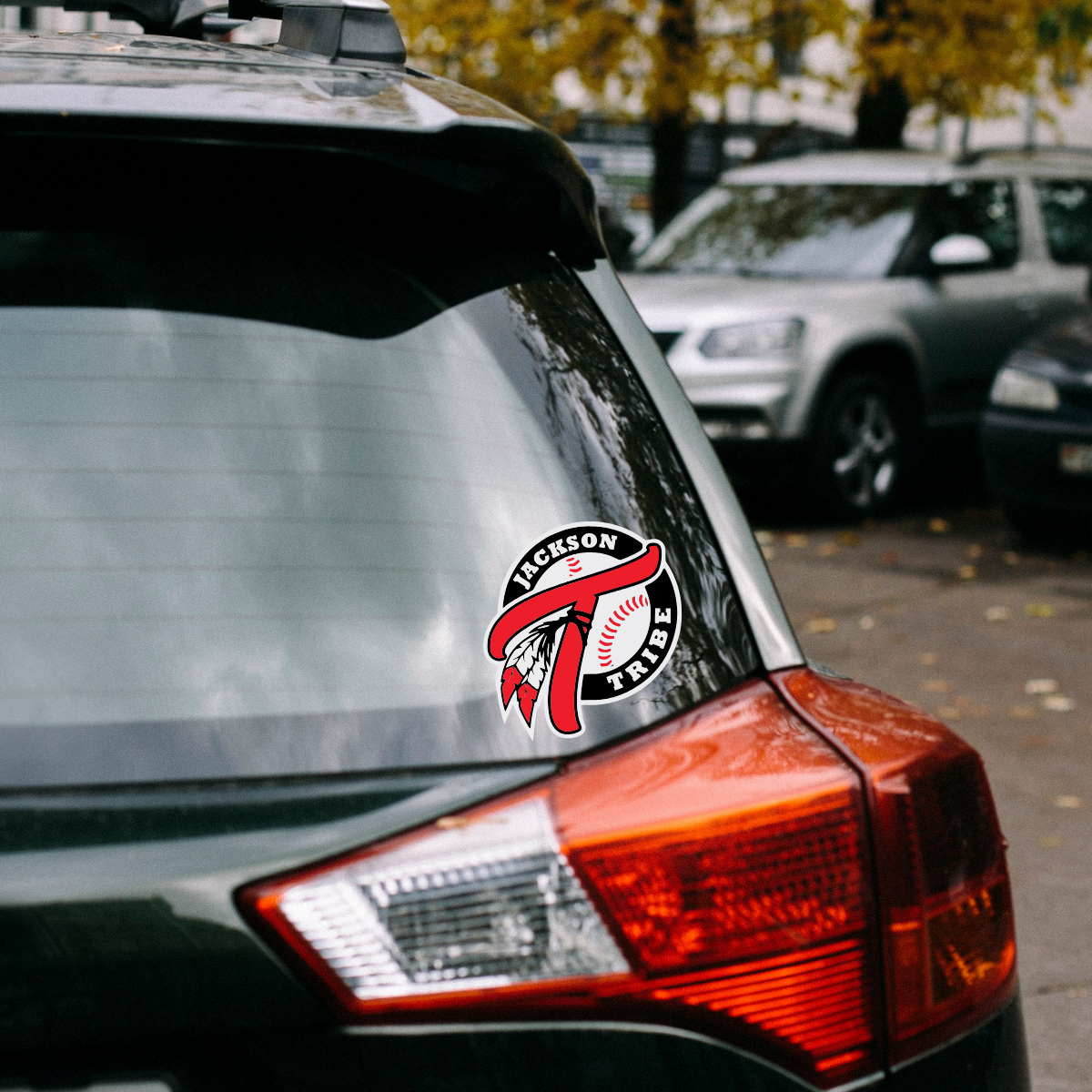 Jackson Tribe Baseball Decal Sticker. Show your team spirit with this vibrant 5" x 5.54" decal sticker! Featuring the bold "Jackson Tribe Baseball" logo, this eye-catching design highlights the team's colors and emblem. Perfect for your car, laptop, or any surface, it's made from durable, weather-resistant material to withstand the elements. Easy to apply and remove, this decal is a must-have for every fan. Shop at Gorgeousware.com