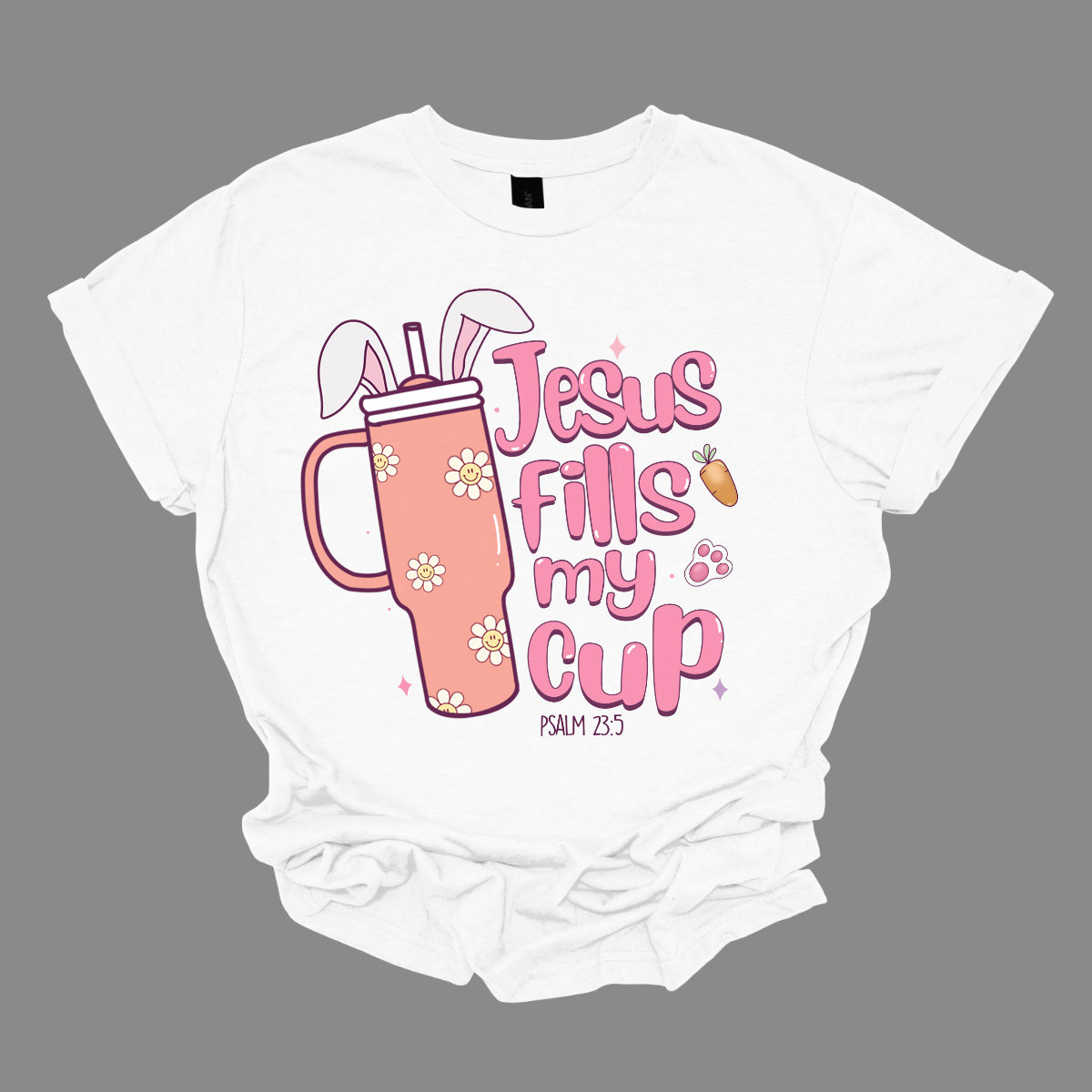 Sip on faith and Easter joy with our 'Jesus fills my cup' T-shirt! Featuring a large handled cup adorned with bunny ears, this shirt is a delightful reminder of the spiritual refreshment Easter brings. Let the world know that your cup overflows with the love and grace of Jesus, making every day a celebration. Shop at Gorgeousware.com