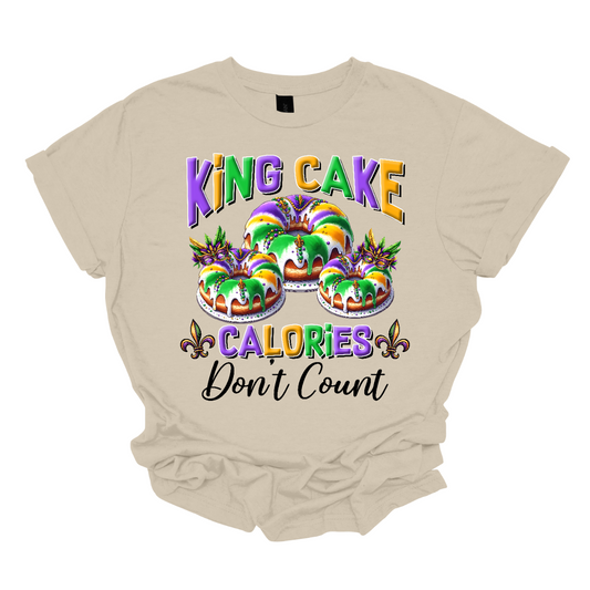 Indulge guilt-free in the sweet delights of Mardi Gras with our 'King Cake Calories Don't Count' t-shirt! Adorned with a whimsical king cake design, this shirt embodies the spirit of celebration and indulgence that defines the season. Whether you're savoring the cinnamon-infused layers of pastry or eagerly searching for the hidden baby, this shirt is a playful reminder that during Mardi Gras, calories simply don't matter Shop at Gorgeousware.com