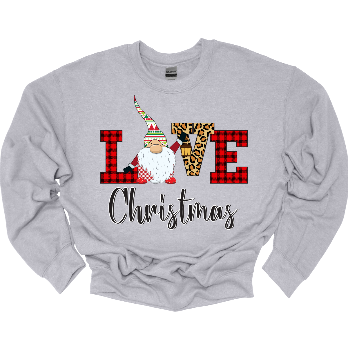 This charming t-shirt showcases the word "LOVE" in a festive and fun design. The letters "L" and "E" are styled in a classic red buffalo plaid, adding a cozy, rustic touch. The "V" pops with a bold cheetah print, bringing an unexpected and trendy flair to the design. The "O" is replaced by an adorable gnome, whose whimsical hat features a cheerful ugly sweater Christmas pattern in vibrant red, green, and white. Shop at Gorgeousware.com