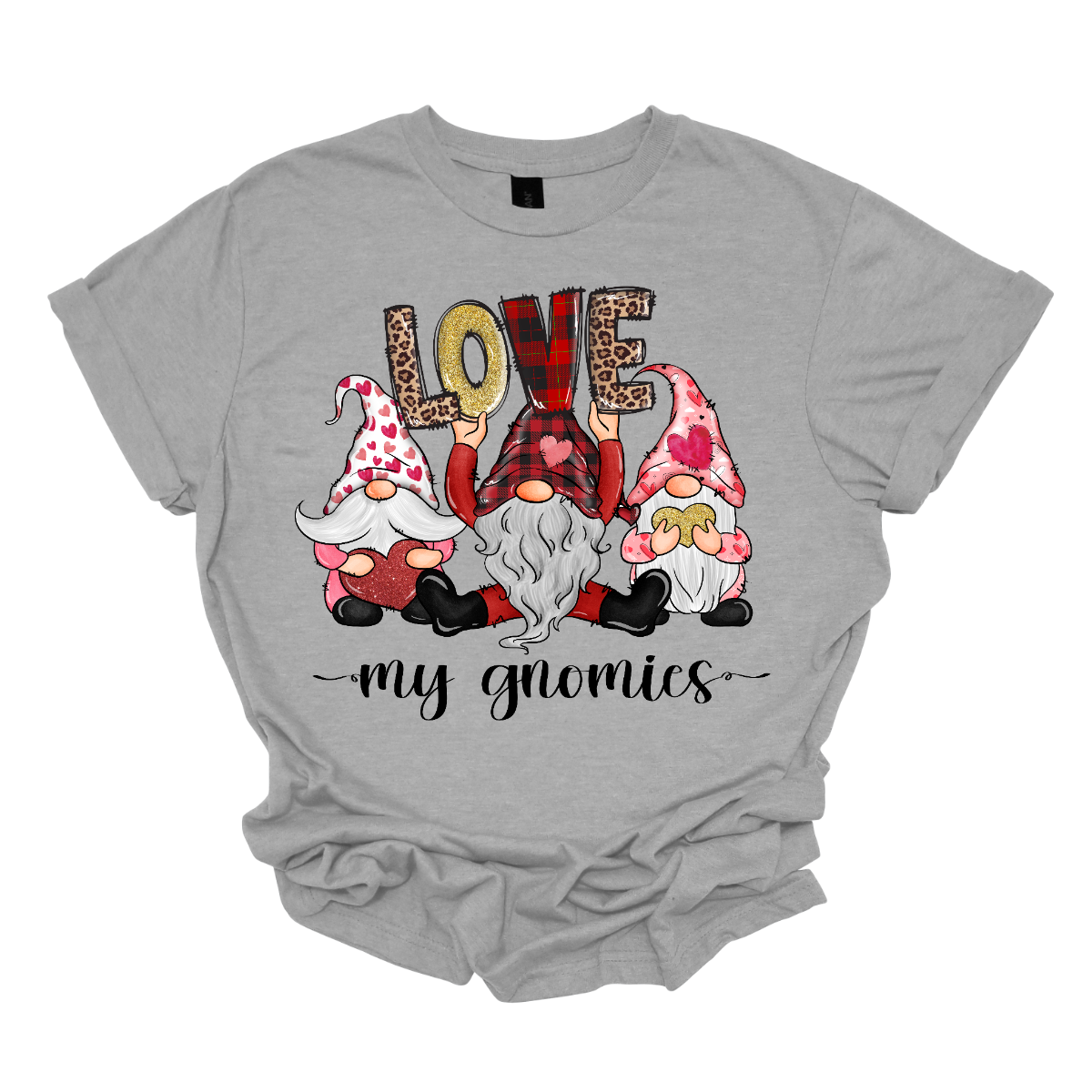 Introducing our "Love My Gnomies" T-shirt – a heartwarming and whimsical garment that celebrates the joy of friendship with three adorable gnomes holding up the word "love." This shirt is a delightful expression of love and camaraderie perfect for Valentine's Day. The design features three adorable gnomes, holding up the word "love," creating a cute and charming scene. Shop at Gorgeousware.com