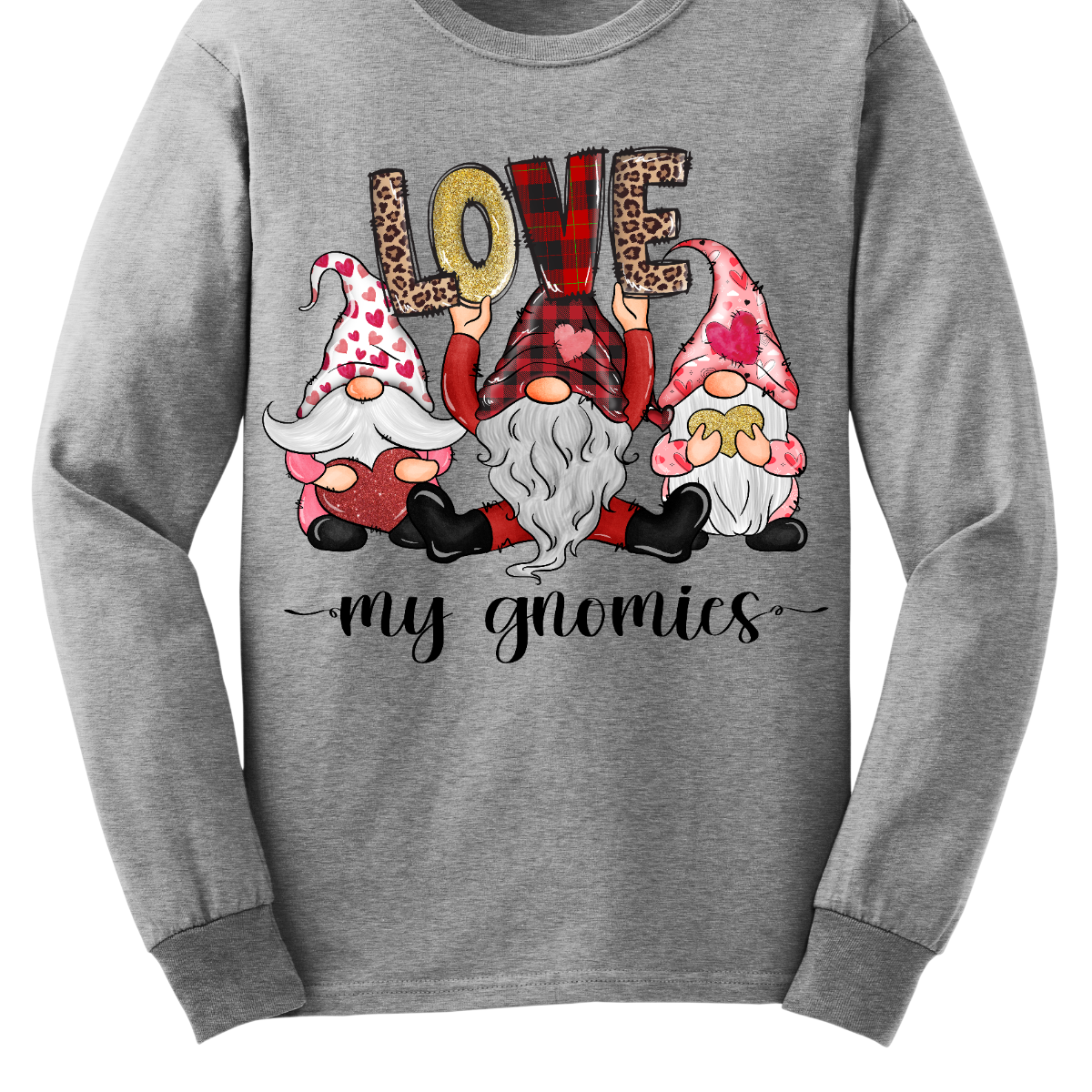 Introducing our "Love My Gnomies" T-shirt – a heartwarming and whimsical garment that celebrates the joy of friendship with three adorable gnomes holding up the word "love." This shirt is a delightful expression of love and camaraderie perfect for Valentine's Day.  The design features three adorable gnomes, holding up the word "love," creating a cute and charming scene. Shop at Gorgeousware.com