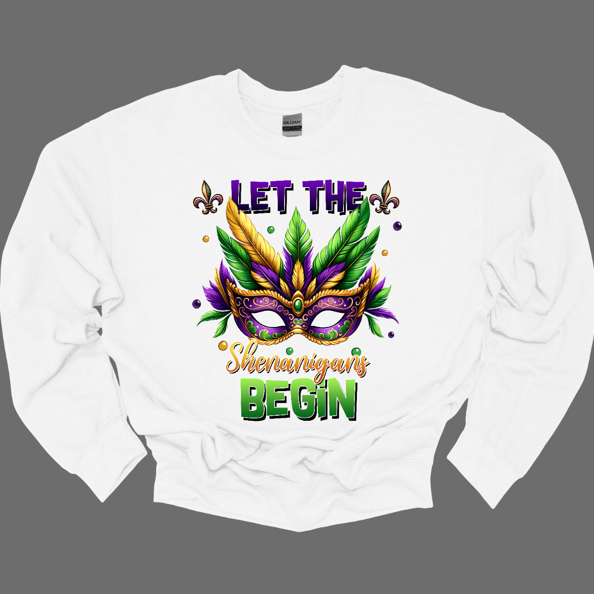 Get ready to unleash the revelry in style with our 'Let the Shenanigans Begin' Mardi Gras shirt! Featuring a vibrant Mardi Gras mask design, this shirt is your ticket to embracing the festive spirit and kicking off the celebration in true New Orleans fashion. Shop at Gorgeousware.com