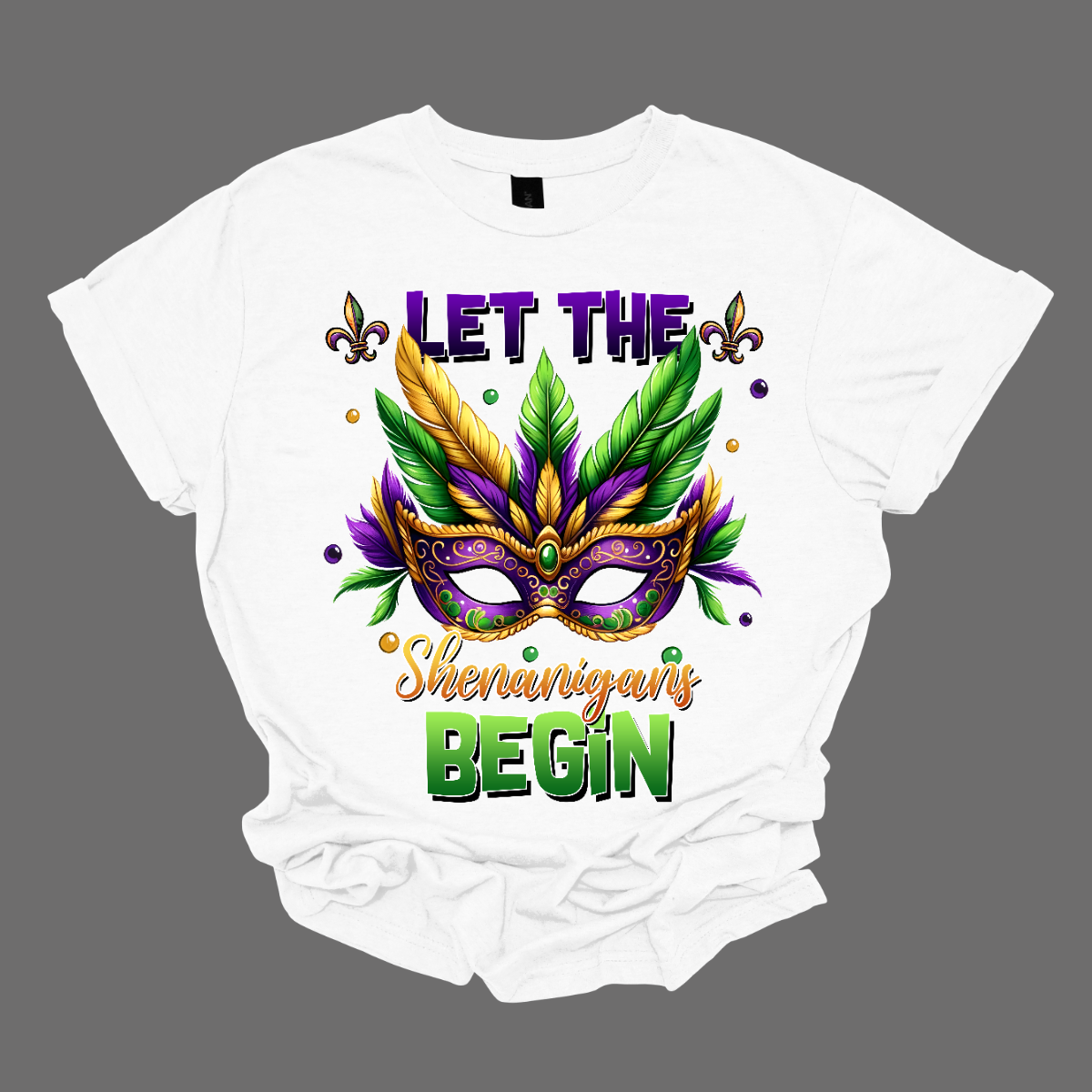 Get ready to unleash the revelry in style with our 'Let the Shenanigans Begin' Mardi Gras shirt! Featuring a vibrant Mardi Gras mask design, this shirt is your ticket to embracing the festive spirit and kicking off the celebration in true New Orleans fashion. Shop at Gorgeousware.com