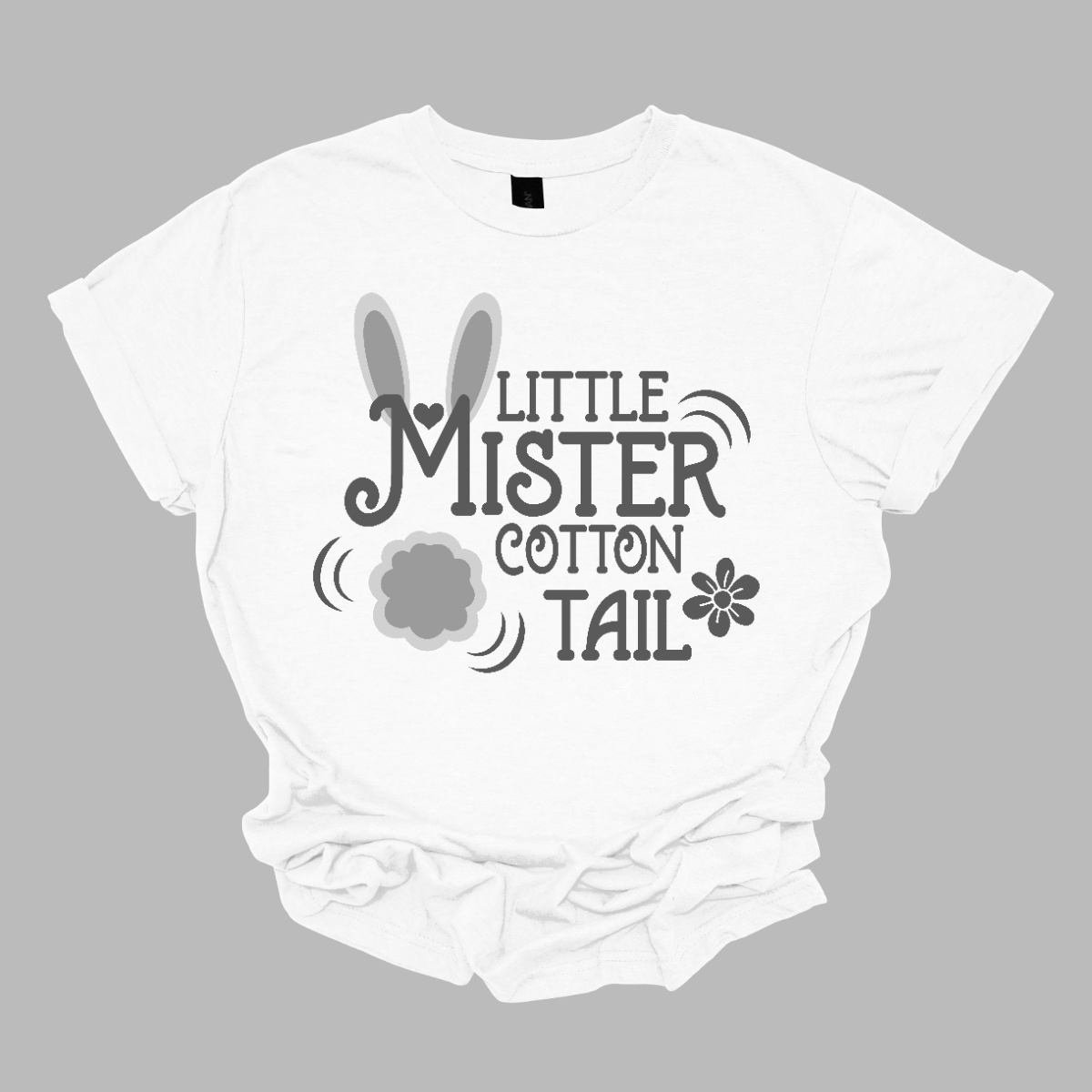 Introducing our adorable 'Little Mr. Cottontail' T-shirt, where the 'M' is adorned with bunny ears and a cotton tail, transforming it into a charming bunny rabbit! Perfect for the little ones who embody the spirit of Easter with their boundless energy and playful nature.  Shop now at Gorgeousware.com