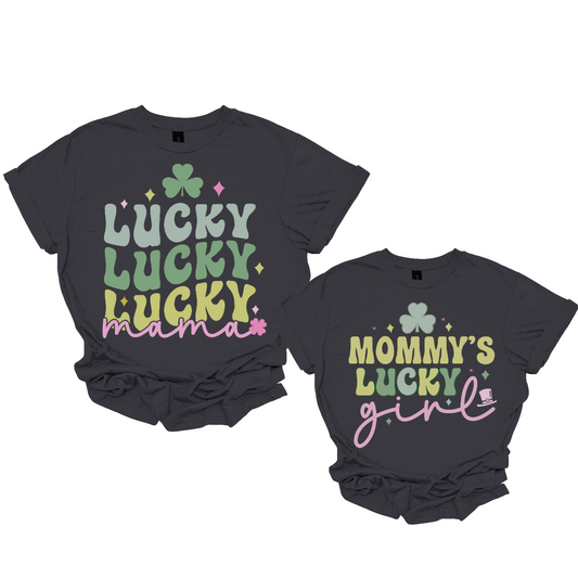 Introducing our "Mama's Lucky" and "Mommy's Lucky Girl" Matching T-shirts – a heartwarming and adorable set designed for the special bond between a mother and her lucky daughter. These shirts are a delightful expression of love and togetherness, perfect for creating cherished memories.  The "Mama's Lucky" T-shirt features a charming design with a lucky clover, symbolizing the unique and fortunate connection between a mother and her child. Shop at Gorgeousware.com