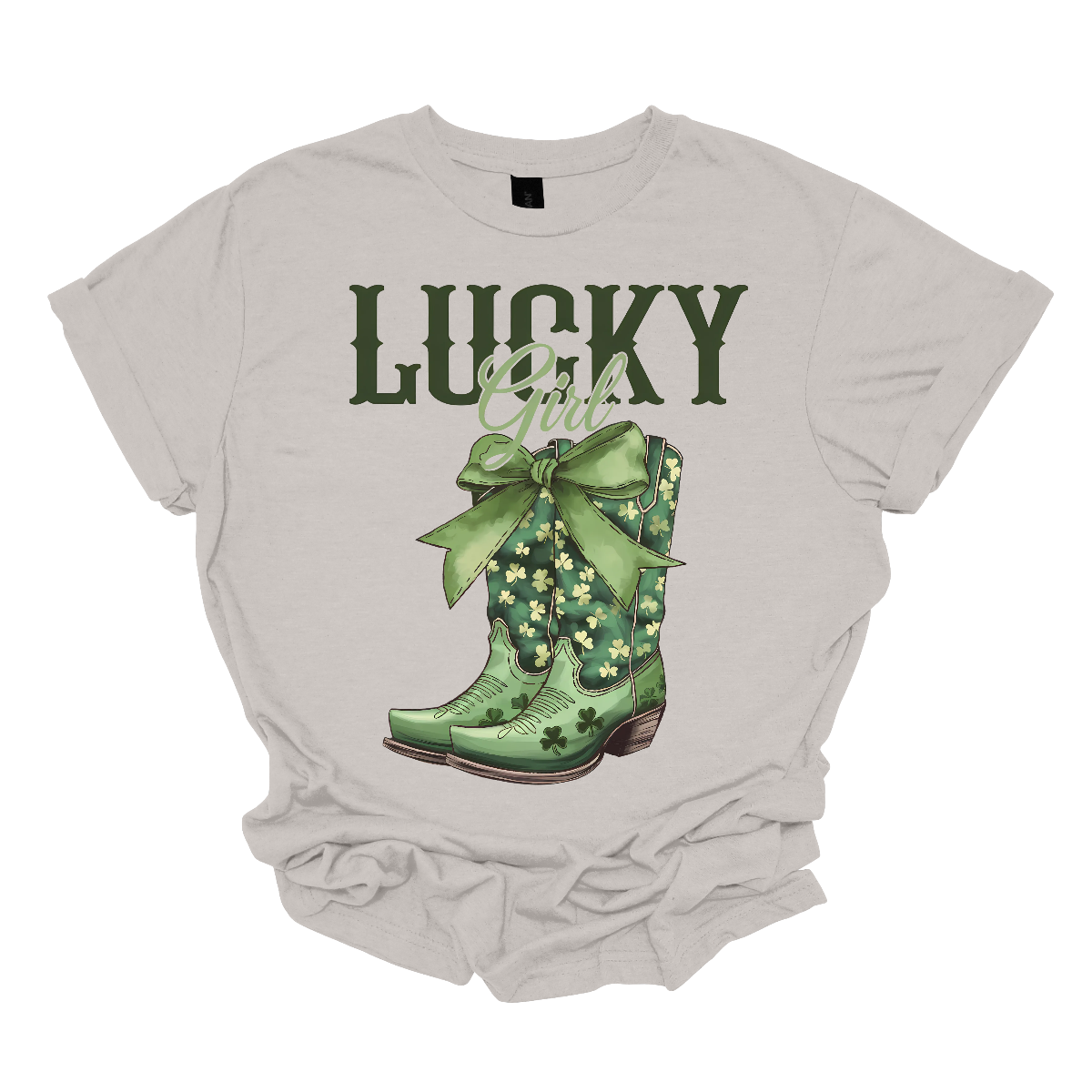 This St. Patrick's Day t-shirt features the word "Lucky" in big, bold military green letters, inspired by the iconic Lucky brand style. Below, the word "girl" is elegantly written in a lighter green, beautiful font, adding a soft touch. Beneath it, a pair of cowgirl boots with a large green bow at the top make a statement. Celebrate in style this St. Patrick's Day with this charming design, available at Gorgeousware.com