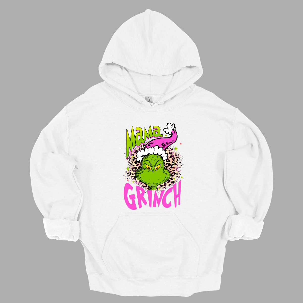 At the center of the design is the phrase "Mama Grinch," rendered in a whimsical, Grinch-style font. The word "Mama" pops in a vibrant green color with a delicate pink shadow that adds a touch of charm. The word "Grinch" contrasts in a bold, eye-catching pink that stands out against the green.&nbsp;Between the two words, there's a delightful illustration of the Grinch himself. He's sporting a cute pink and white Santa hat, which adds a fun and seasonal flair. Shop Gorgeousware.com