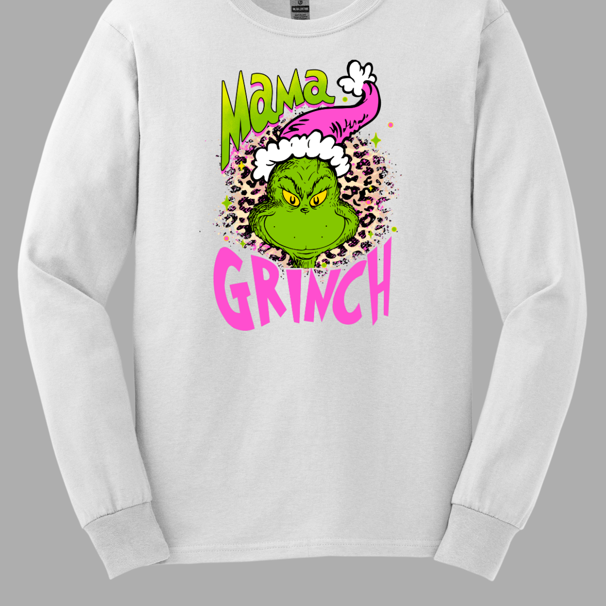 At the center of the design is the phrase "Mama Grinch," rendered in a whimsical, Grinch-style font. The word "Mama" pops in a vibrant green color with a delicate pink shadow that adds a touch of charm. The word "Grinch" contrasts in a bold, eye-catching pink that stands out against the green.&nbsp;Between the two words, there's a delightful illustration of the Grinch himself. He's sporting a cute pink and white Santa hat, which adds a fun and seasonal flair. Shop Gorgeousware.com