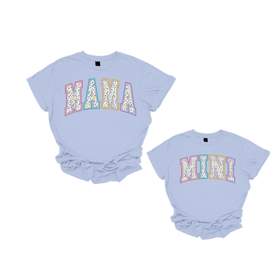 "Mama" and "Mini" Easter T-shirts - Celebrate the bond between mother and child with our charming matching set! Adorned with adorable peeps forming the words "Mama" and "Mini," these Easter-themed shirts are as sweet as can be. Whether you're hunting for eggs, enjoying a springtime picnic, or simply spending quality time together, these shirts are the perfect way to showcase your special connection.  Shop at Gorgeousware.com