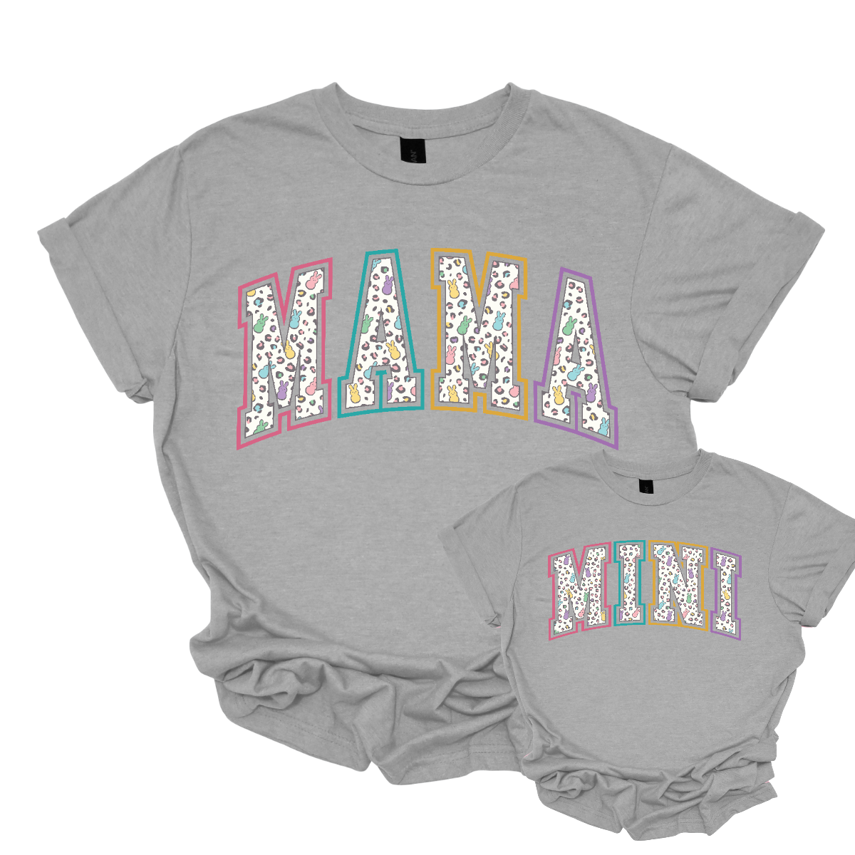 "Mama" and "Mini" Easter T-shirts - Celebrate the bond between mother and child with our charming matching set! Adorned with adorable peeps forming the words "Mama" and "Mini," these Easter-themed shirts are as sweet as can be. Whether you're hunting for eggs, enjoying a springtime picnic, or simply spending quality time together, these shirts are the perfect way to showcase your special connection. Shop at Gorgeousware.com