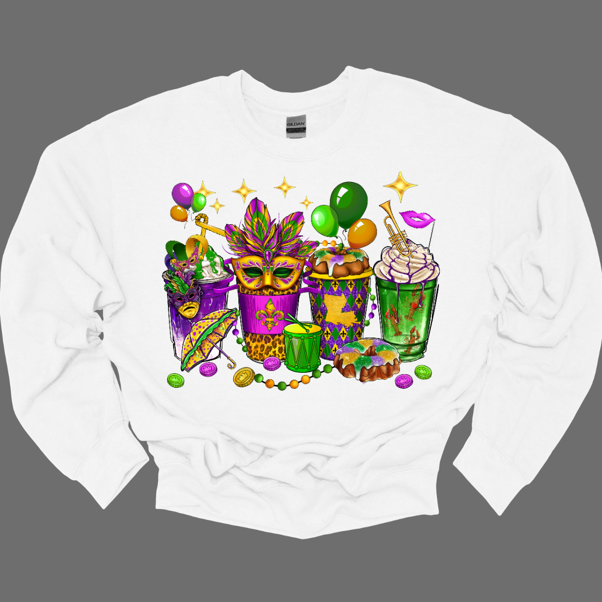 A vibrant and spirited homage to the lively festivities of this iconic carnival celebration. This shirt is a visual masterpiece, adorned with a dazzling array of symbols that encapsulate the true essence of Mardi Gras. From the intricate masquerade masks that evoke the mystery and allure of the carnival to the beaded necklaces that symbolize the joyous spirit of giving, this T-shirt is a tapestry of Mardi Gras symbols. Shop at Gorgeousware.com