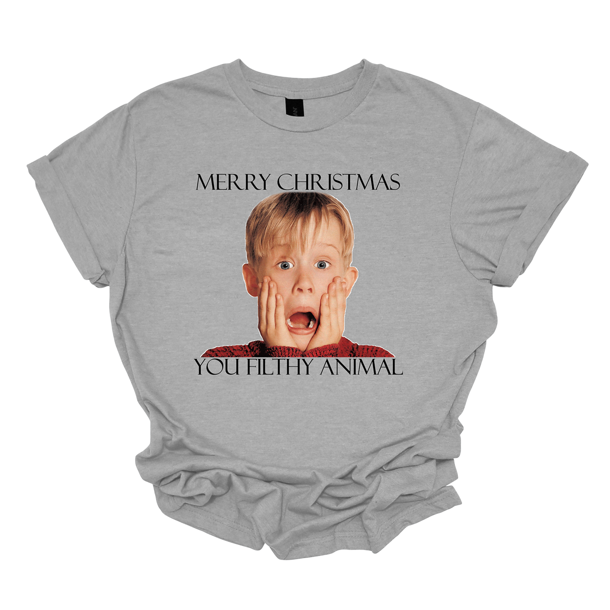 This fun and festive apparel features the iconic phrase "Merry Christmas You Filthy Animal" in bold, playful lettering, a memorable line from the Home Alone movie. The design also showcases the infamous face of Kevin McCallister, played by Macaulay Culkin, with his hands on his cheeks in a dramatic, surprised expression. Perfect for any Home Alone fan, this shirt or sweatshirt is ideal for spreading some holiday cheer and nostalgia.  Shop at Gorgeousware.com