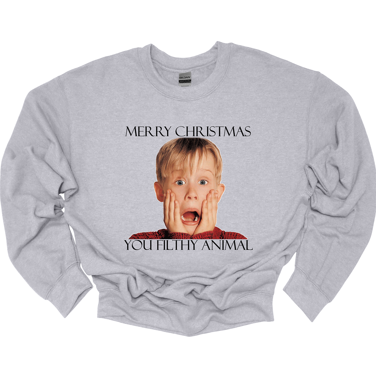 This fun and festive apparel features the iconic phrase "Merry Christmas You Filthy Animal" in bold, playful lettering, a memorable line from the Home Alone movie. The design also showcases the infamous face of Kevin McCallister, played by Macaulay Culkin, with his hands on his cheeks in a dramatic, surprised expression. Perfect for any Home Alone fan, this shirt or sweatshirt is ideal for spreading some holiday cheer and nostalgia.  Shop at Gorgeousware.com