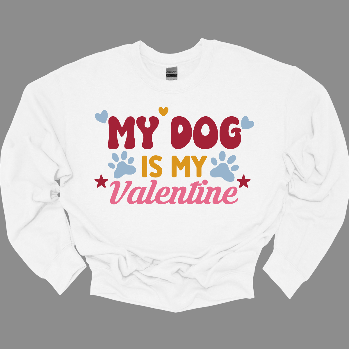  Declare your furry love story with our 'My Dog is My Valentine' T-shirt. This charming tee is a perfect expression of the deep bond between you and your canine companion. The heartfelt message takes center stage, surrounded by paw prints, capturing the unconditional love and loyalty that only a dog can offer. Shop at Gorgeousware.com today!