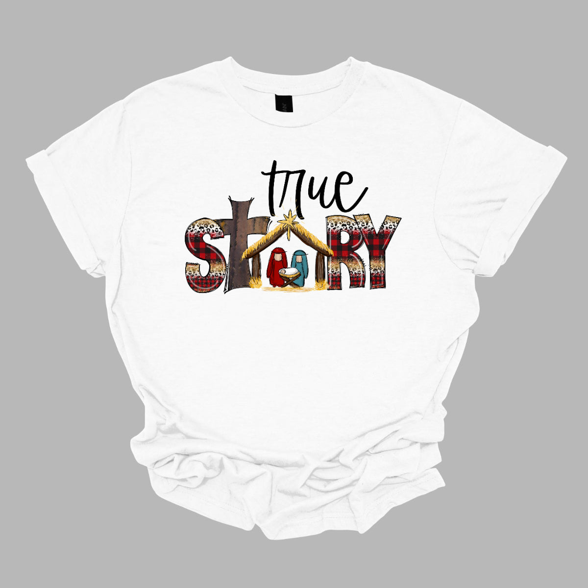 The T-shirt design features the phrase "True Story" in a distinctive and meaningful way. The word "True" is written in an elegant, flowing cursive font that adds a touch of sophistication and personal flair. The word "Story" is presented in a bold, straightforward font for contrast and clarity. Shop Gorgeousware.com