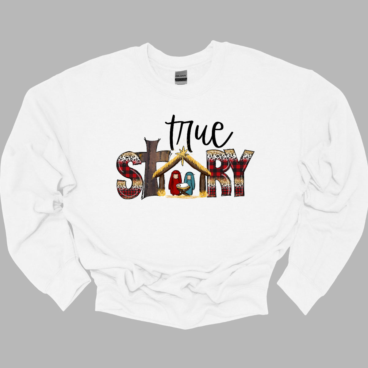 The T-shirt design features the phrase "True Story" in a distinctive and meaningful way. The word "True" is written in an elegant, flowing cursive font that adds a touch of sophistication and personal flair. The word "Story" is presented in a bold, straightforward font for contrast and clarity. Shop Gorgeousware.com