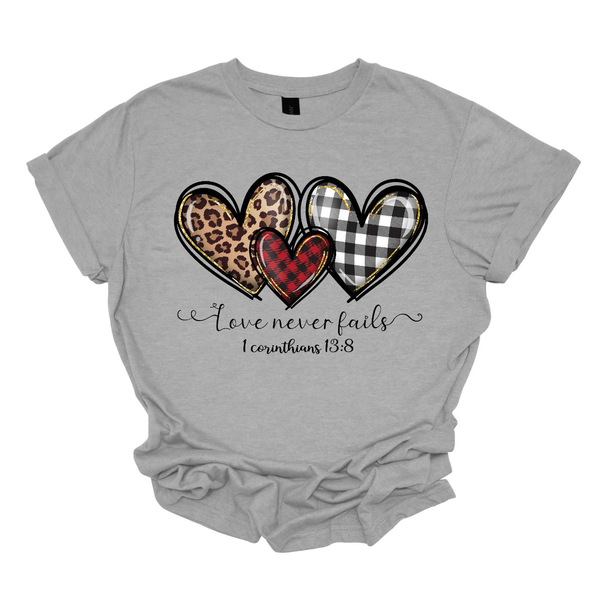 Introducing our "Love Never Fails - 1 Corinthians 13:8" T-shirt – a profound and heartwarming garment adorned with three adorable patterned hearts. This shirt carries a timeless message inspired by the scripture, emphasizing the enduring nature of love. The phrase "Love Never Fails - 1 Corinthians 13:8" is elegantly displayed, drawing inspiration from the Bible verse. Surrounding the sentiment are three cute hearts, each uniquely patterned with delightful designs. Shop at Gorgeousware.com