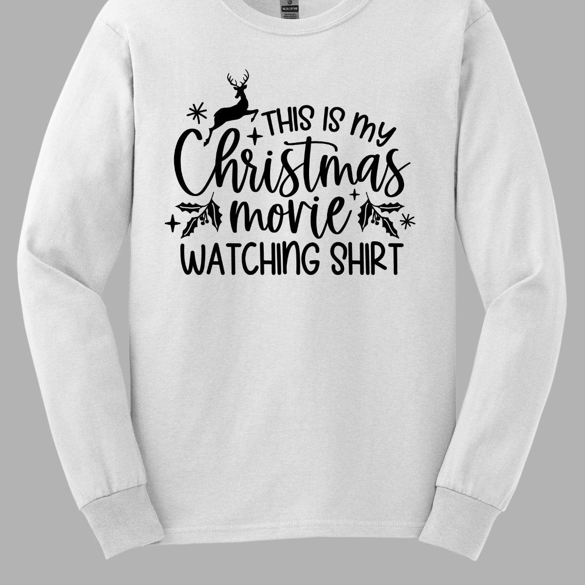 This cozy t-shirt features the playful phrase "This Is My Christmas Movie Watching Shirt" in a straightforward, easy-to-read font. The words "Christmas Movie" are beautifully highlighted in an elegant cursive font, adding a touch of festive flair. Shop Gorgeousware.com