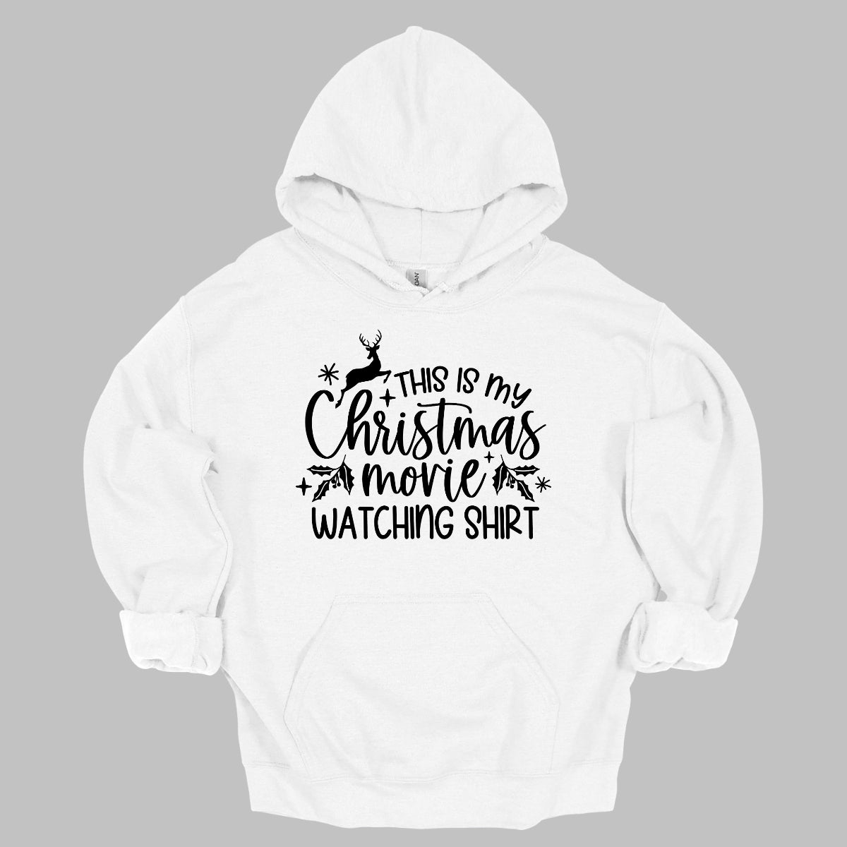 This cozy t-shirt features the playful phrase "This Is My Christmas Movie Watching Shirt" in a straightforward, easy-to-read font. The words "Christmas Movie" are beautifully highlighted in an elegant cursive font, adding a touch of festive flair. Shop Gorgeousware.com