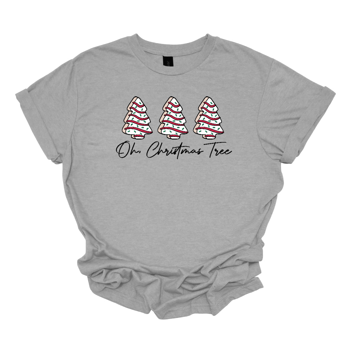 This t-shirt features a whimsical holiday design that’s perfect for spreading cheer. The shirt is adorned with the phrase “Oh Christmas Tree” written in elegant black cursive font, adding a touch of sophistication to the festive message. Above the words, three iconic Christmas tree snack cakes are illustrated, each depicted with their classic, playful decorations. Shop Gorgeousware.com