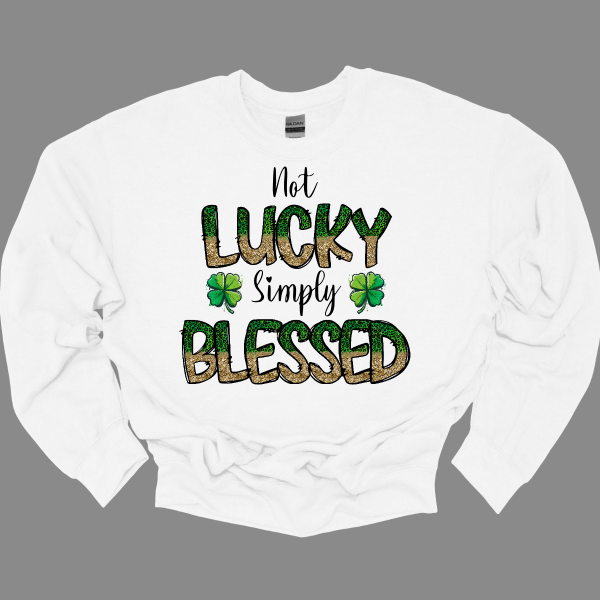 Introducing our "Not Lucky, Simply Blessed" T-shirt, a heartfelt expression of gratitude and positivity! This inspiring design features bold green and gold letters that stand out against a solid background, making a stylish statement wherever you go. Wear it with jeans for a casual look, or dress it up with a skirt for a more polished ensemble. However you choose to style it, this T-shirt is sure to make a statement and inspire those around you. Shop at Gorgeousware.com