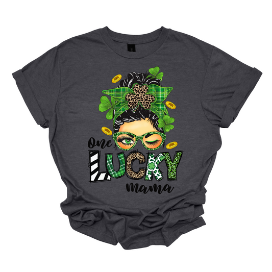 Embrace your mom pride with our charming "One Lucky Mama" T-shirt! This adorable design features a whimsical illustration of a mom sporting a messy updo and trendy green glasses, exuding a fun and carefree vibe. Celebrate the joy of motherhood in style with our "One Lucky Mama" T-shirt. It's a must-have addition to your wardrobe and also makes a thoughtful gift for any proud mama in your life. Wear it with pride and let the world know just how lucky you feel to be a mom! Shop at Gorgeousware.com
