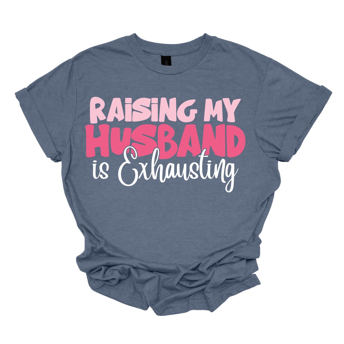 This T-shirt features the humorous phrase "Raising My Husband Is Exhausting" prominently across the chest. The text is creatively arranged in a mix of playful and quirky fonts, each each line standing out with a unique style. The color palette is a soft and vibrant pink, with a varying shade to enhance the fun and lighthearted vibe of the design.  Shop at Gorgeousware.com