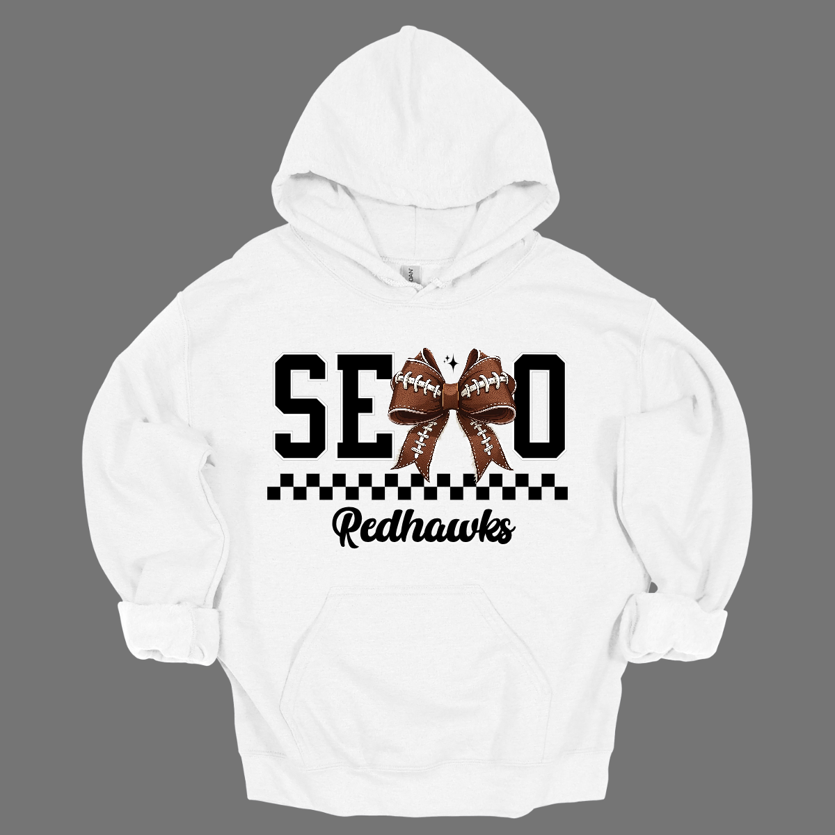 Gear up your Redhawk fan with our stylish youth SEMO apparel, available in short/ long sleeve, crewneck, and hoodie options! Featuring bold black SEMO lettering with a creative twist—the letter M is playfully replaced by a croquette football bow, adding a fun, sporty vibe. A sleek checkerboard underline ties the look together, while "Redhawks" is written in a stylish cursive script for the perfect finishing touch.
Shop at Gorgeousware.com today!
