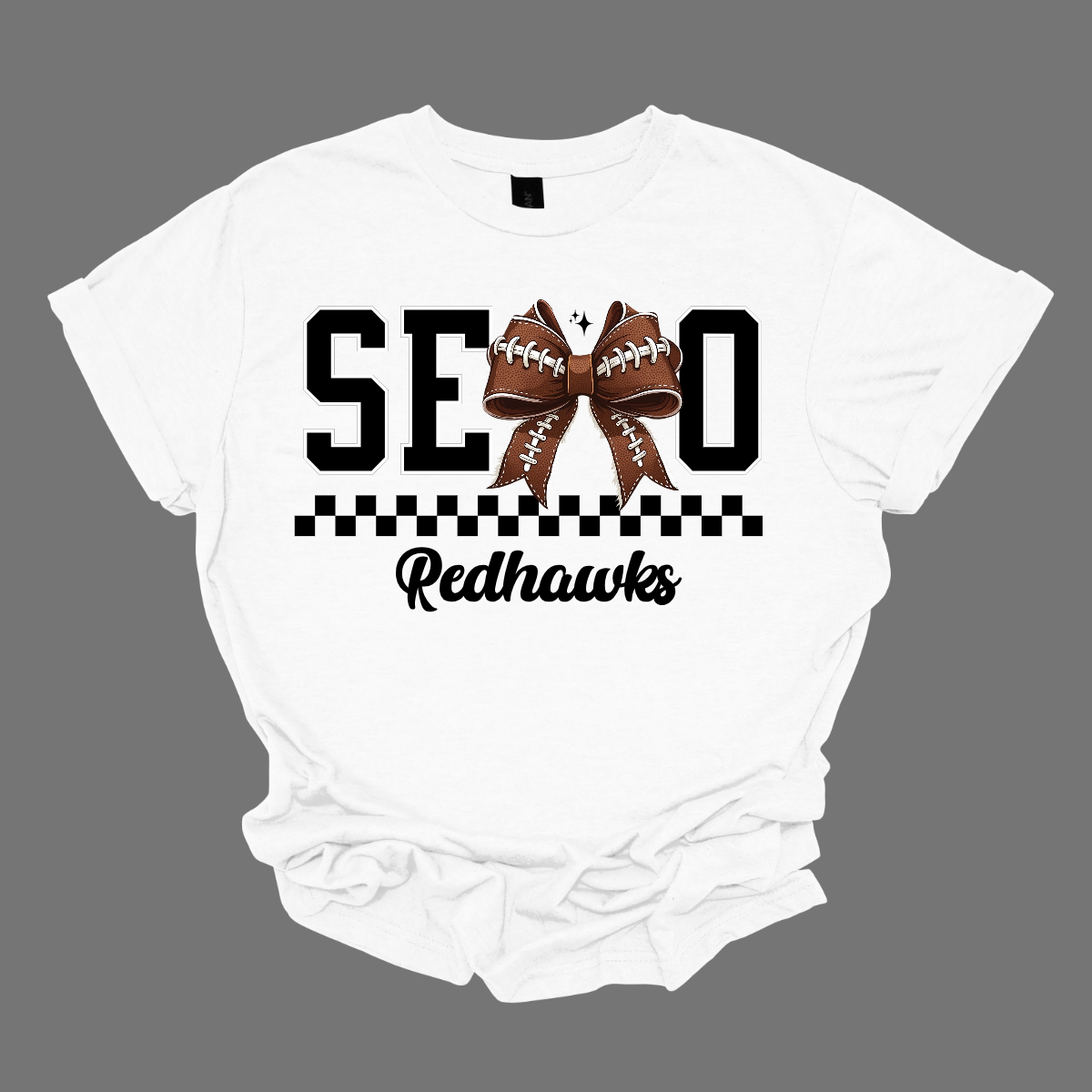 Gear up your Redhawk fan with our stylish youth SEMO apparel, available in short/ long sleeve, crewneck, and hoodie options! Featuring bold black SEMO lettering with a creative twist—the letter M is playfully replaced by a croquette football bow, adding a fun, sporty vibe. A sleek checkerboard underline ties the look together, while "Redhawks" is written in a stylish cursive script for the perfect finishing touch.
Shop at Gorgeousware.com today!
