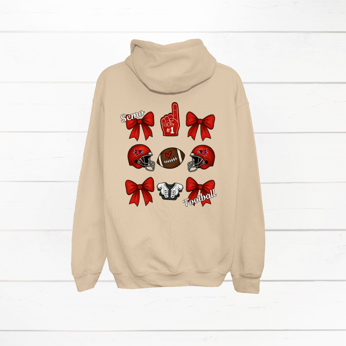 This SEMO Football Bow Grid design is available in crewneck, and hoodie options.
Front Design: A chic red croquette bow sits on the upper left chest, accented with bold white “SEMO” lettering.
Back Design: A playful grid layout showcases an exciting mix of Redhawk game-day icons—red croquette bows, SEMO football helmets, sturdy shoulder pads, and the classic #1 foam hand—all celebrating SEMO’s winning spirit.
Shop at Gorgeousware.com today!
