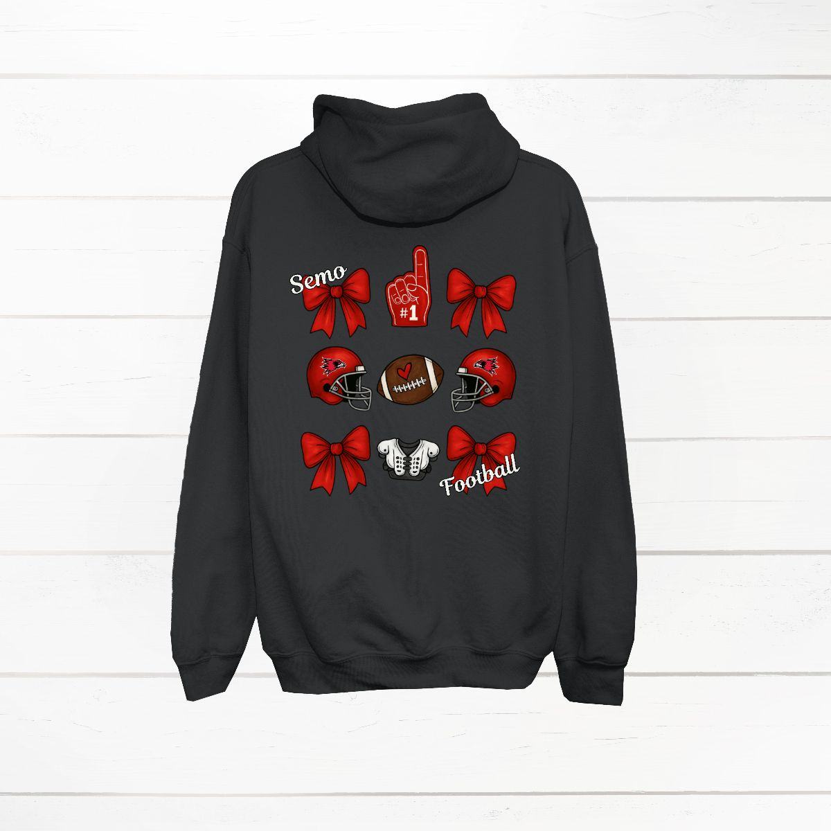 This SEMO Football Bow Grid design is available in youth sizes across short sleeve, long sleeve, crewneck, and hoodie options.
Front Design: A chic red croquette bow sits on the upper left chest, accented with bold white “SEMO” lettering.
Back Design: A playful grid layout showcases an exciting mix of Redhawk game-day icons—red croquette bows, SEMO football helmets, sturdy shoulder pads, and the classic #1 foam hand—all celebrating SEMO’s winning spirit.
Shop at Gorgeousware.com today!
