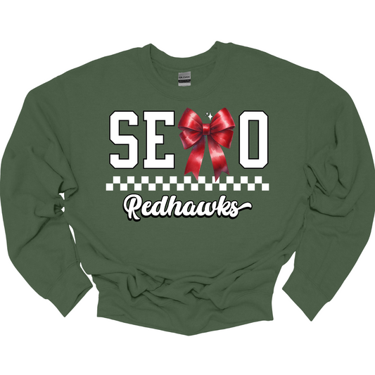This SEMO crewneck features white lettering outlined in black with a creative twist - the letter "M" is a stylish red bow for a pop of color and school spirit. A classic checkerboard line runs through the center for a trendy, eye-catching look, while the design is completed with "Redhawks" in script underneath for the perfect final touch.
Shop at Gorgeousware.com today!
