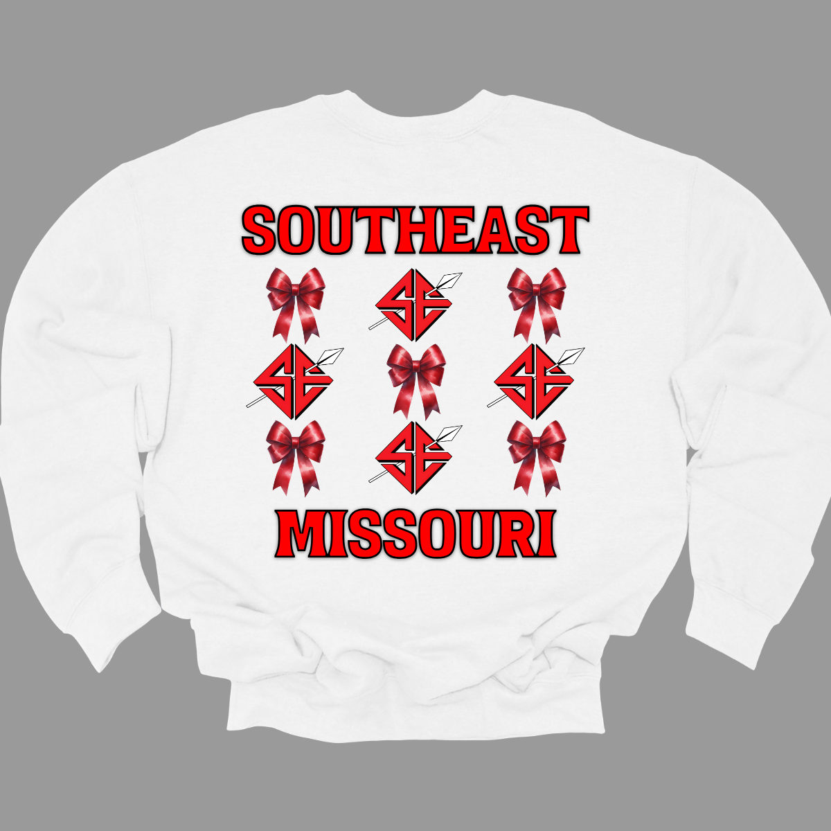 **The front will have a bow on the left chest pocket area.

Show off your collegiate pride with our SEMO Sagamore Bow! With a grid pattern of red croquette bows and the SE spear logo, the word "southeast" displayed on the top and "Missouri" on the bottom, this shirt is perfect for any SEMO fan. The front pocket design features a matching red croquette bow. Available in short or long sleeve options. Shop at Gorgeousware.com