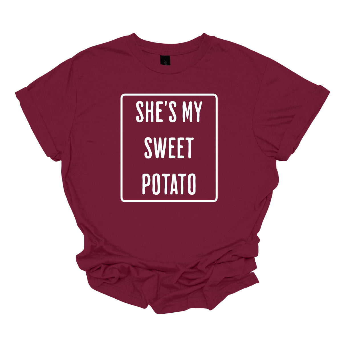 The first t-shirt features the phrase "She’s My Sweet Potato" in a basic, bold font. The text is prominently displayed and encircled by a solid white border, which adds a clean and crisp contrast to the font, making the words stand out. Shop Gorgeousware.com