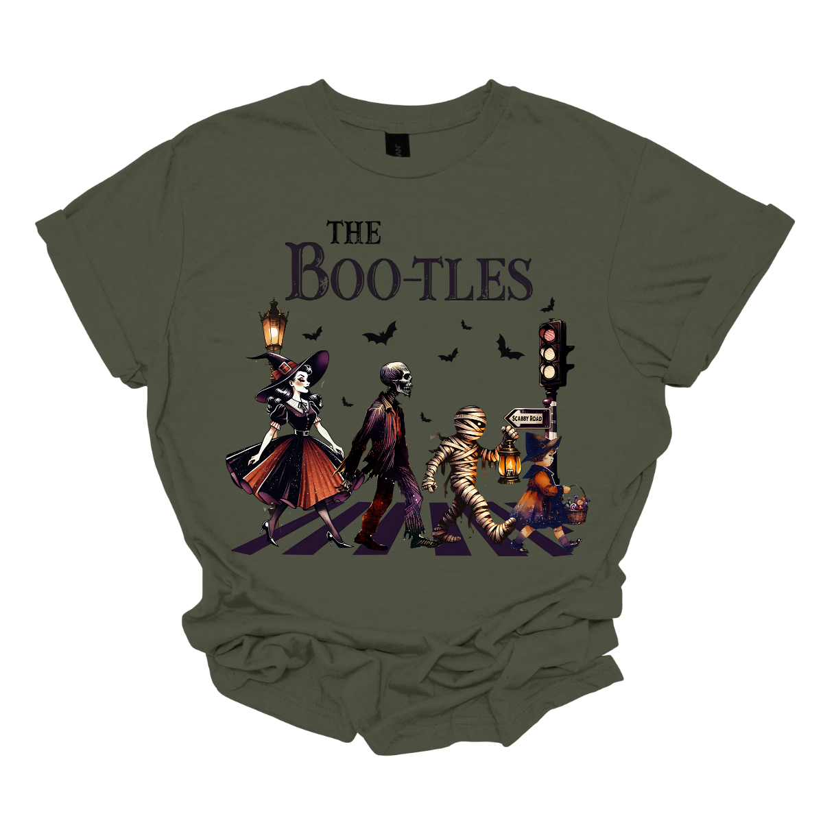 Step into a spooky twist on a classic with our 'Boot-les' tee! This Halloween-themed shirt takes inspiration from the iconic Abbey Road album cover and reimagines it with a creepy-cool lineup of Halloween characters. Picture this: a mischievous witch, a spooky skeleton, a creepy mummy, and a charming little witch, all crossing a spectral road in style.  Shop at Gorgeousware.com