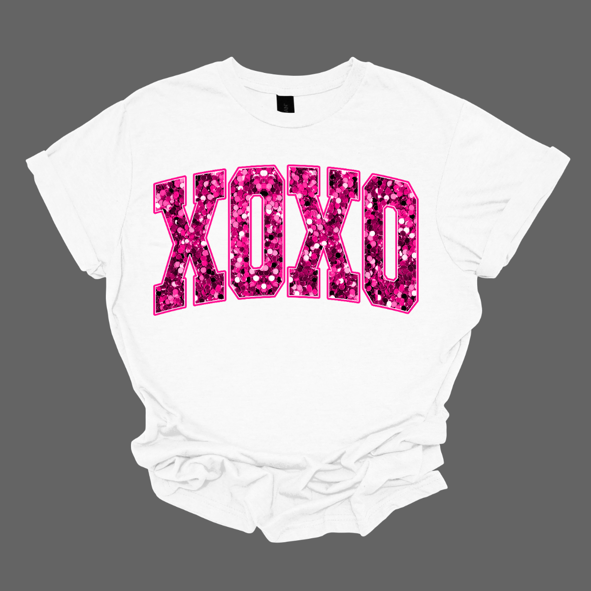 Introducing our Hot Pink Faux Sequin "XOXO" T-shirt – a chic and stylish garment that adds a touch of glamour without the actual sequins. This shirt features the classic "XOXO" expression in a vibrant hot pink faux sequin design, creating a bold and trendy look. Shop at Gorgeousware.com